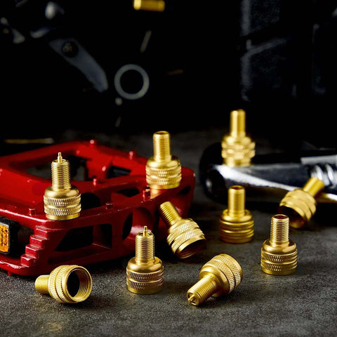 20 Pcs Large Bore Tire Valve Adapters Brass 22mm External Stem Reducers Connectors in gold on a table