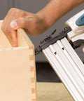 Rock Solid 18 Gauge 2 Inch Brad Nailer Kit in use, demonstrating precise fastening on a wood drawer joint.