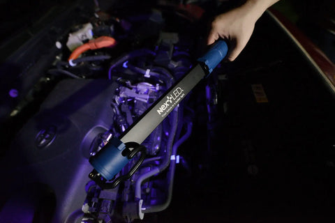 Rechargeable Portable COB LED And UV Work Light With 1000 Lumens USB C Cordless Drop Light illuminating a car engine