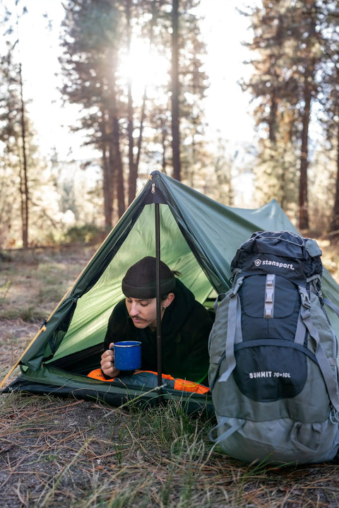 Person using Forest Scout Backpack Tent for Quick Camp Setup Lightweight Frame Shelter With 1000mm PU Coated Polyester
