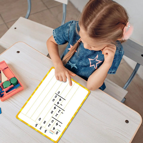 Child using 12 Pack Double Sided Whiteboards 9x12 Inches For Math Practice Long Division Dry Erase Lapboards at a school desk