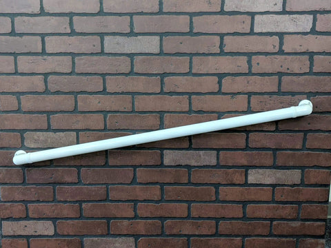 No Sweat 10 Ft Wall Mounted Aluminum Handrail In Gloss White With Returns secured to a brick wall, providing support for steps.