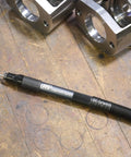 Air Pencil Grinder Kit With One Eighth Inch Collet 60,000 RPM Inline Rear Exhaust Includes Five Mounted Points And Five Carbide Burrs on workbench
