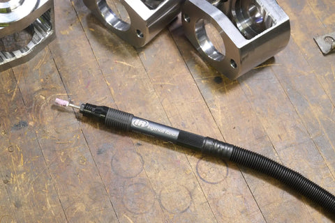 Air Pencil Grinder Kit With One Eighth Inch Collet 60,000 RPM Inline Rear Exhaust Includes Five Mounted Points And Five Carbide Burrs on workbench