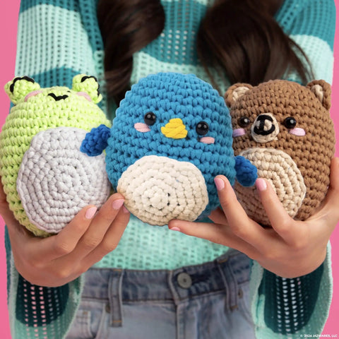 Child holding animal crochet toys from Bluebird Crochet Kit For Beginners With Pre Started Magic Loops Yarn Crochet Hook Starter Hooks And Step By Step Tutorials An Exclusive DIY Craft Kit That Makes Learning To Crochet Fun For Teens And Newbies