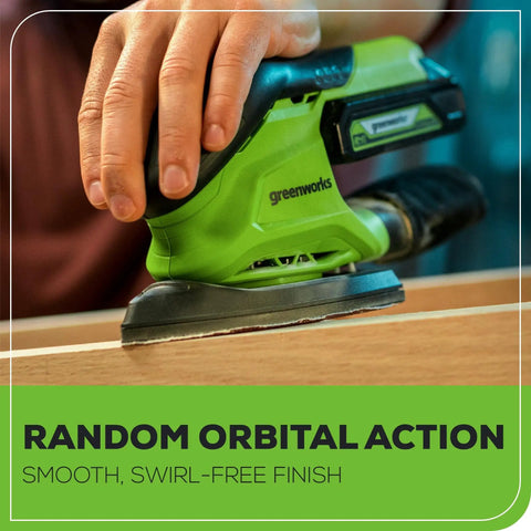 Cordless 24V Mouse Detail Sander With 11,000 OPM Orbit in use on wood surface, showing green sander with removable dust bag and battery