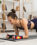Woman doing yoga wearing Copper Infused Adjustable Wrist Support Splint For Carpal Tunnel Relief Fits Both Hands on left wrist