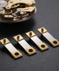 Old School Pendulum Suspension Spring Replacement Kit for Vintage Grandfather Clocks detail view of springs and clock mechanism