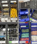 Heavy Duty 100 Drawer Steel Small Parts Cabinet with organized bins of nuts, bolts, and small parts in various colors.