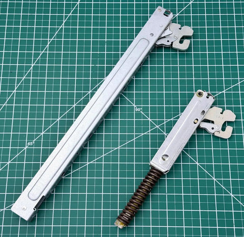 Top Shelf Wall Oven Door Hinge Set Built From Heavy Duty Silver Metal Compatible With Major Appliances Rock Solid Replacement Parts To Get Your Oven Running Smooth As Silk Today - metal arms showing left and right pieces.