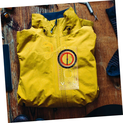 Lightweight Hiking Compass With Map Ruler on yellow jacket, Rugged Metal Pocket Navigation Tool For Outdoor Camping And Backpacking