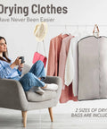 Woman sitting with Portable Electric Clothes Dryer With Shoe Drying Attachment And Foldable Drying Rack and drying bags.