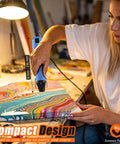 Person using Dual Temp Heat Gun With Two Speed Settings 250C And 350C 482F And 662F Fast Heat For DIYers on craft project