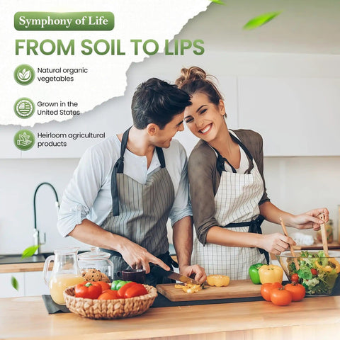 Couple cooking in kitchen with vegetables and cutting boards, promoting natural organic vegetables and heirloom products.