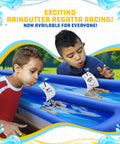 Kids racing Trimaran Race Boat Kit for Raingutter Regatta, Easy Build DIY Model, in inflatable raceway outdoors.