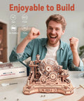 3D Wooden Puzzle And Marble Run Kit For Adults And Teens, Build And Play DIY Gear Ball Challenge With Auto Lift, Ramps And Victory Bell, Retro Gamepad Styled Model Building Toy For Christmas And Birthday Gifts. Wooden marble run kit, 653 pieces, built on table.