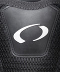 Close-up of Photon Pro Women's Back-Inflation BCD With Modular Harness And Integrated Weight System logo on black mesh fabric.