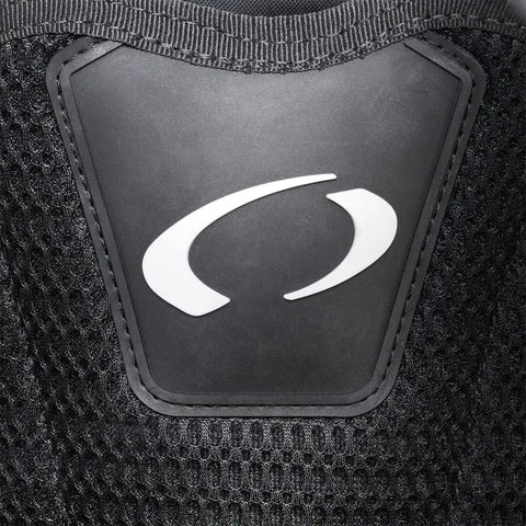 Close-up of Photon Pro Women's Back-Inflation BCD With Modular Harness And Integrated Weight System logo on black mesh fabric.