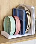 StoreMore Adjustable Bakeware Rack With Steel Wires Seven Adjustable Dividers organizing trays and pans on kitchen shelf.