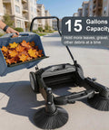 42 Inch Walk Behind Floor Sweeper With Dual Side Brushes And Fifteen Gallon Dustbin for collecting leaves and debris in a driveway.
