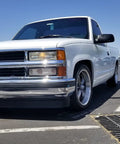 Chevy Silverado 1500 1988 To 1998 with Lowering Kit parked showing front profile and drop stance in parking lot.