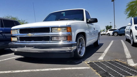 Chevy Silverado 1500 1988 To 1998 with Lowering Kit parked showing front profile and drop stance in parking lot.