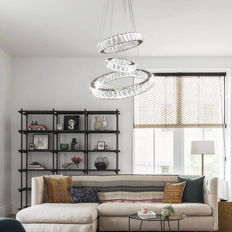Modern Gold Finish Three Ring LED Crystal Chandelier Pendant Light For Living Room Dining Room Bedroom Foyer With Adjustable Height And 50W Power 85 265 Volt Cool White hanging above a sofa in a stylish living room.