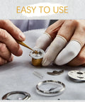 Hands using a tool to adjust a watch with parts, highlighting the Watch Band Pins Replacement Kit For Metal Watch Straps With Spring Bars.