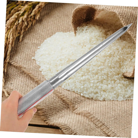 Person using Stainless Steel Grain Sampler With Rubber Handle Portable Fertilizer Probe For Accurate Wheat Seed And Soil Sampling Durable Farm And Laboratory Use over rice pile