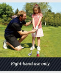 Instructor teaching girl with Kids Golf Set For Ages 3 To 8 Adjustable Indoor Outdoor Complete Kit on a grassy field