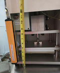 Workhorse Benchtop Pneumatic Press With Foot Pedal For Hands Free Operation, Dual Safety Light Curtains, And Adjustable Dwell Timer For Blister Packaging, Stamping, Riveting, And Component Assembly close-up with safety sensor and tape measure