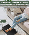 Woman relaxing on beige sofa with All In One Grounding Mat Kit With 15Ft Cord for foot mats computer desk and sleep mat on floor