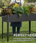 Person gardening with Two Pack 32 Inch Tall Raised Garden Beds With Wheels Dual Drainage System Planter Box For Backyard Patio Balcony