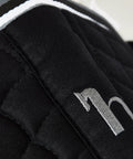 Close-up of Adepto Quilted Quick-Dry Dressage Saddle Pad For Horses With Two-Tone Trim Black Checkered Pattern Quilting