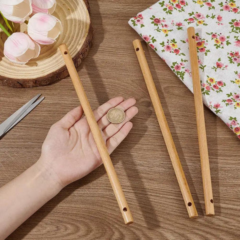 Three Six Top Shelf Wooden Dowel Rods With Dual Center Holes 11 8 Inch Solid Hardwood Sticks displayed with a coin for size reference.
