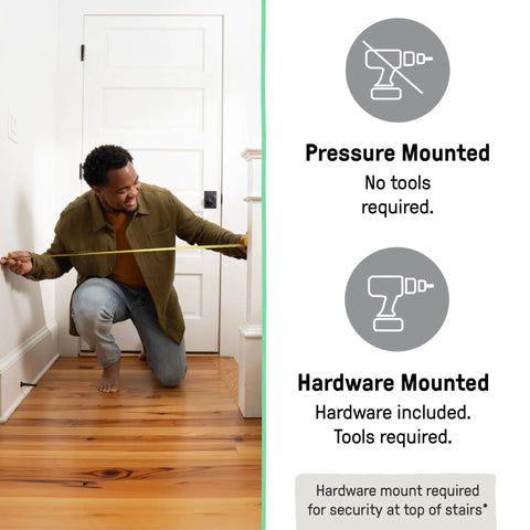 Man measuring doorway for extra tall baby and pet gate for stairs and doorways no drill pressure mounted fits openings from 28.5 to 48 inches 36 inch height install at top or bottom of stairs banister or hallway bronze finish.