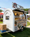 Boot Up Your Culinary Hustle With This Dope Mobile Catering Trailer Featuring Smooth AC Cooling And A Crisp White Mailbox Layout Perfect For Cafe Setups Or Street Food Ventures Straight From The Factory Floor With No Rip Off Pricing. Mobile catering trailer with a white exterior and serving window.