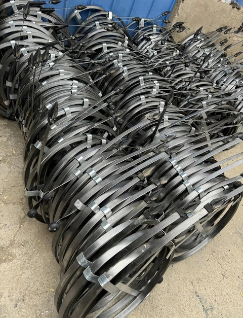 Rock Solid Manual Steel Drain Snake Auger with 5cm Thick Flat Bar Cable Handles stacked, ready for yard maintenance.