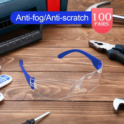 Heavy Duty Safety Glasses Bulk Pack With Clear Lenses And Durable Blue Frames Engineered For The Daily Grind No Nonsense Eye Guard Gear For Job Sites Labs And Working Crews on a wood surface with tools.