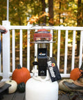 Front view of 540-Degree 45,000 BTU Tank Top Radiant Propane Heater with multi directional heat mounted on a 20 lb propane tank outdoors.
