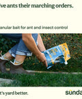 Person sprinkling Ant Adios Outdoor Bug And Ant Killer with Spinosad in garden for pest control, targeting ants and more.