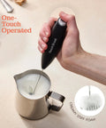 Game Changing Handheld Milk Frother Wand Battery Operated Stainless Steel Drink Mixer in use with stainless steel jug