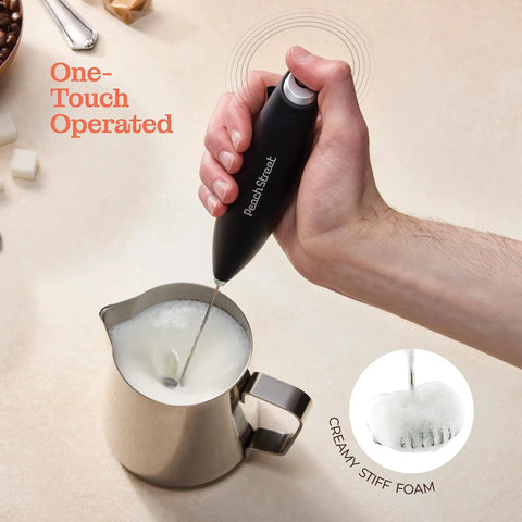 Game Changing Handheld Milk Frother Wand Battery Operated Stainless Steel Drink Mixer in use with stainless steel jug