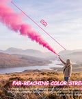 Big Time Gender Reveal Sprayers 2 Pack Biodegradable Color Powder Blasters in use creating 10ft pink smoke cloud outdoors.