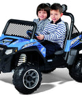 Two children sitting in a blue ride-on Polaris RZR 900 toy car with visible front and side design.