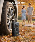 Cordless Tire Inflator With Gauge Up To 160 PSI Portable Car Air Pump in use beside car wheel outdoors