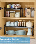 Built Tough Expandable Cabinet Shelf Organizer Set Featuring Adjustable Countertop Storage Rack To Knock Out Clutter And Keep Your Kitchen Stuff Locked In, two-tier storage with jars and mugs.