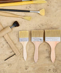 Wood Handle Paint Brush Set, 3 Pack Flat Stain Brushes For Furniture And Wood, Multi Size 2.5 Inch, 3 Inch, 4 Inch on beige surface