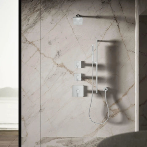 Modern bathroom with Parallel SF 1.75 GPM Showerhead In Polished Chrome, sleek circular inset square design, on marble wall.