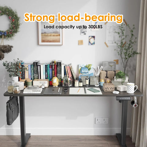 Solid Electric Adjustable Standing Desk With 40x24 Inch Tabletop, folding corner office table, set up with books and stationery.